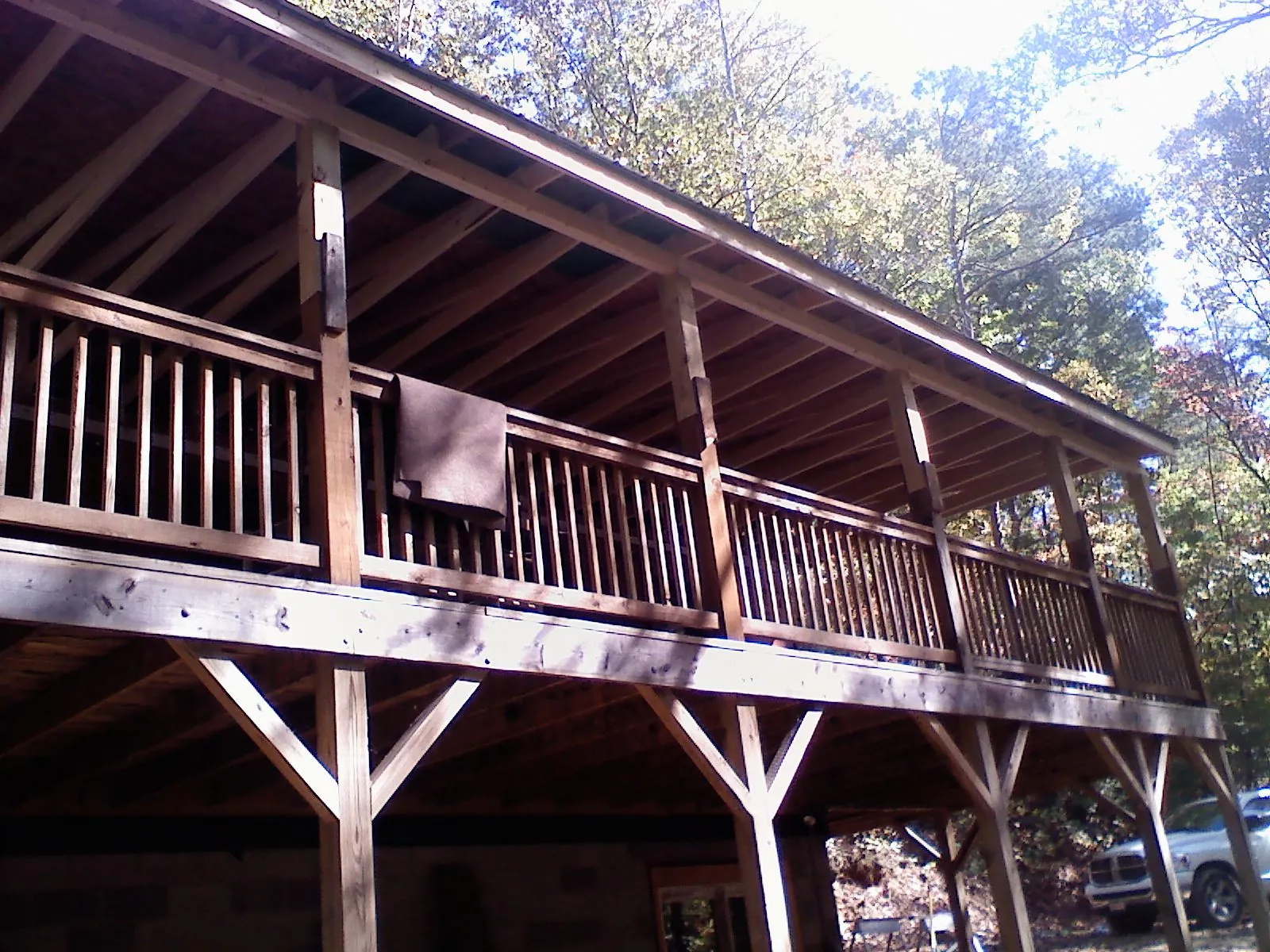 Timber framing under a new elevated porch and deck — Roof Leak Repair in Howe by Roofing Brothers